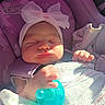 baby, newborn, sleeping, pacifier, headband, bow, car_seat, purple, blanket, infant, cute, peaceful, small_hands, wrapped, indoors, child, person, soft_light, nap, resting