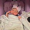 Adalyn is registered to the contest to win money with this photo: newborn, baby, sleeping, blanket, car_seat, purple, headband, pink_bow, graco, infant, child, wrapped, peaceful, resting, cute, portrait, indoors, soft_lighting, small_hands, fabric