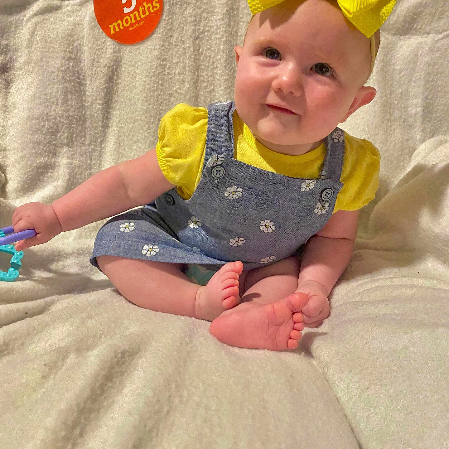 Emersyn joined the competition — help win amazing prizes! accessories, baby, bed, bedroom, clothing, face, furniture, happy, hat, head, homedecor, pants, person, photography, portrait, quilt, sitting, smile, t_shirt, toy