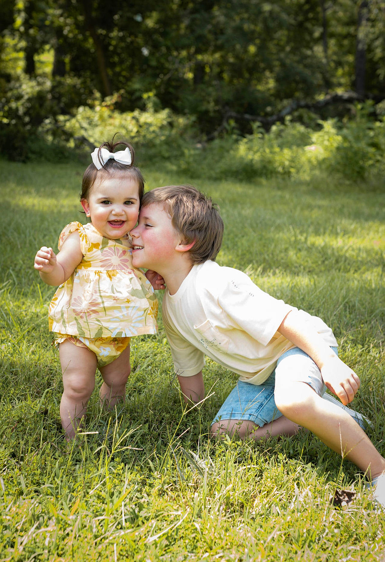 Willow is registered to the contest to win money with this photo: baby, baby_toddler_clothing, child, eye, flash_photography, fun, grass, grassland, happy, joy, lawn, leaf, leisure, meadow, people_in_nature, person, plant, playing_with_kids, sitting, smile