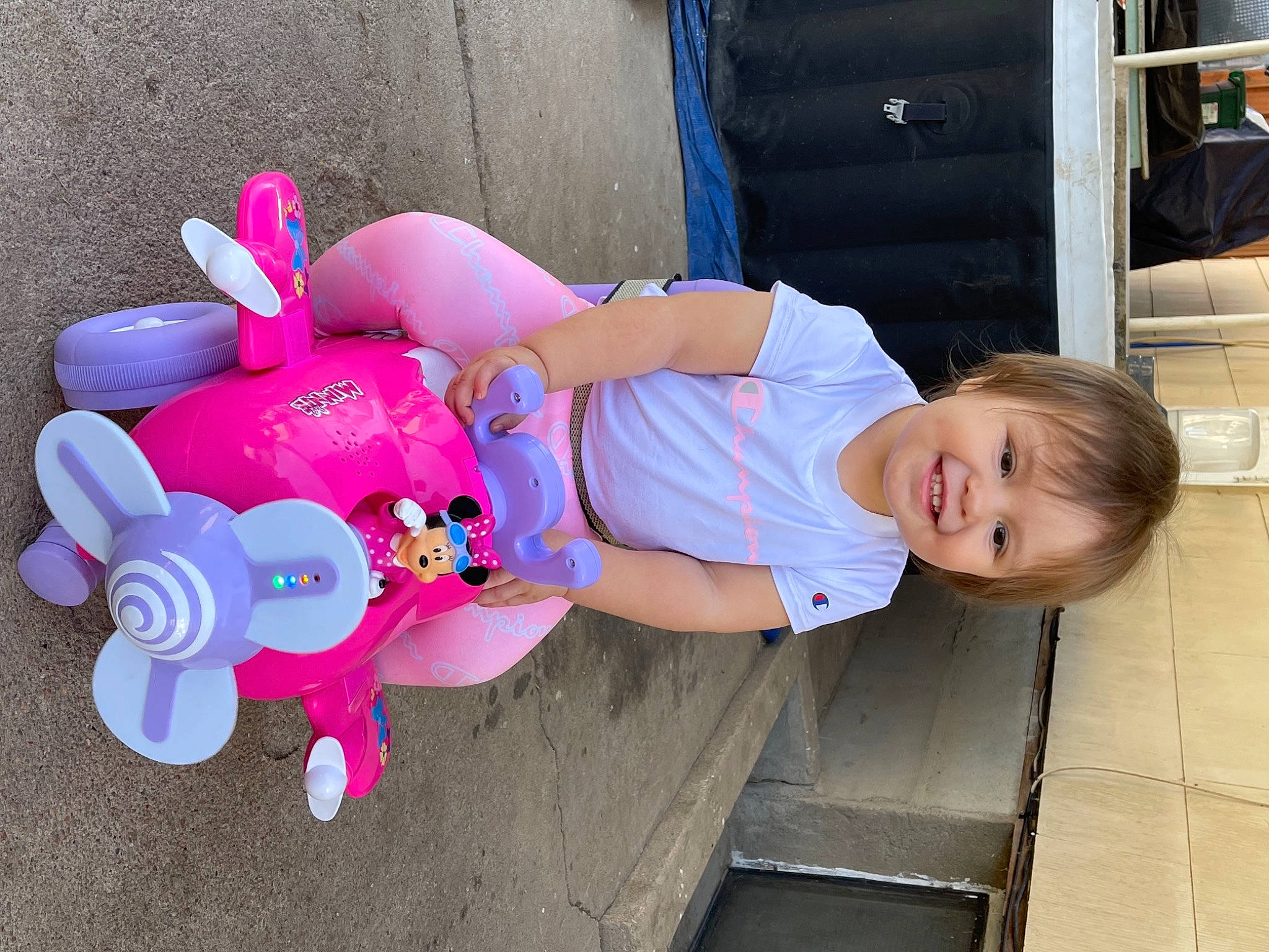 Amethyst is registered to the contest to win money with this photo: baby_toddler_clothing, child, fun, happy, hat, joy, leg, leisure, magenta, person, pink, public_space, recreation, sandal, shorts, smile, stuffed_toy, thigh, tire, toddler
