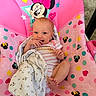 baby, infant, blanket, pink, mickey_mouse, minnie_mouse, child, smiling, seat, polka_dots, stars, cute, happy, indoors, toddler, clothing, face, head, feet, hand