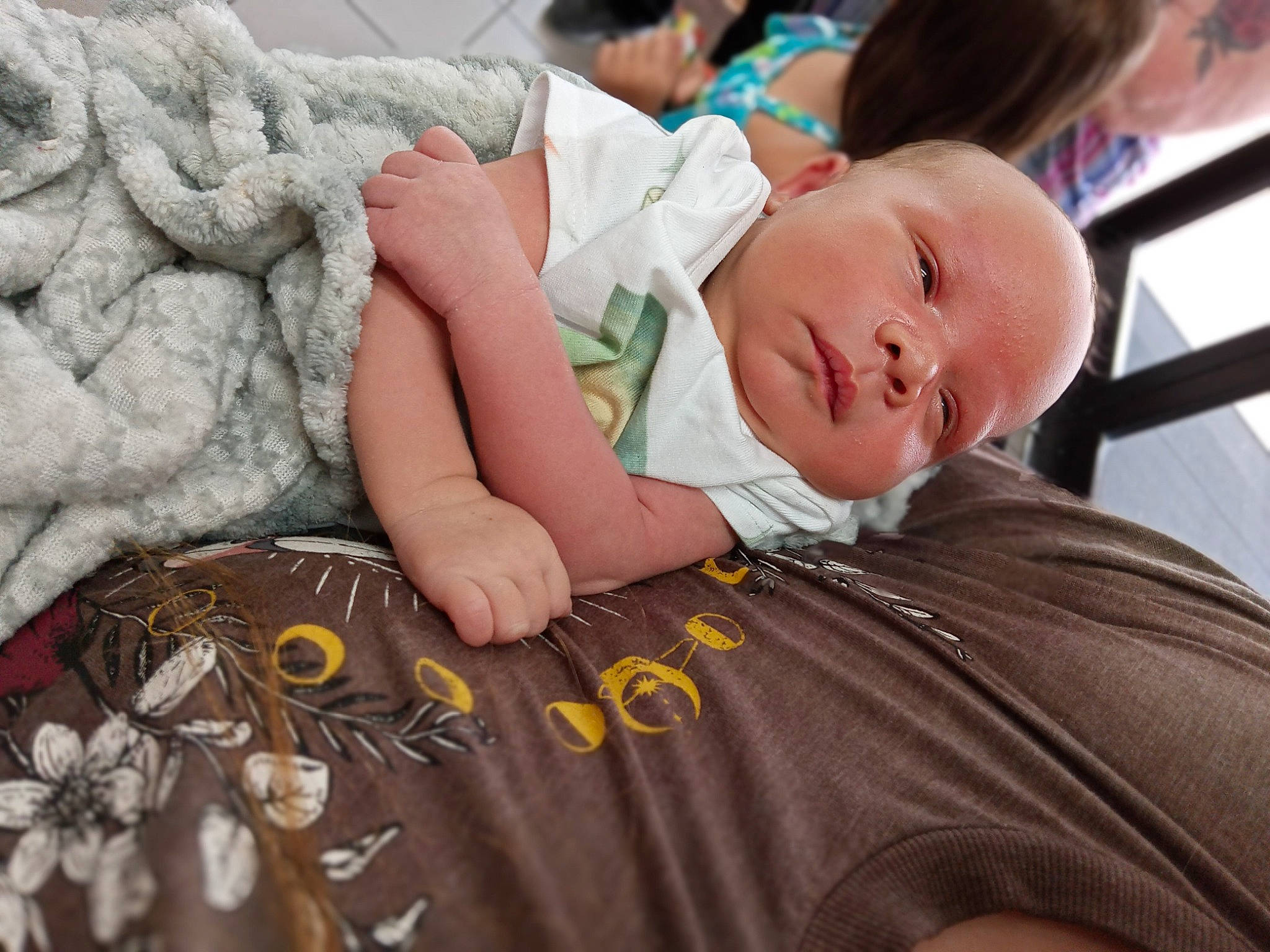 Logan is registered to the contest to win money with this photo: baby, baby_products, baby_toddler_clothing, bedtime, child, comfort, event, fur, grass, happy, head, linens, pattern, person, portrait_photography, room, sitting, skin, sleep, t_shirt