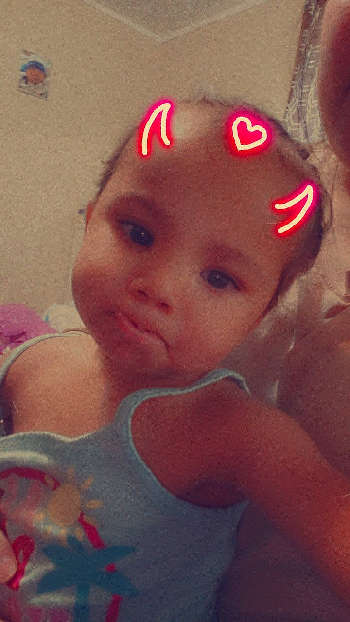 Londynn is registered to the contest to win money with this photo: baby, baby_toddler_clothing, cap, cheek, child, chin, eyebrow, eyelash, face, fun, hair_accessory, hairstyle, happy, head, headgear, lip, magenta, person, pink, skin