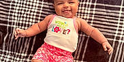 Zorie joined the competition — help win amazing prizes! baby, smiling, infant, blanket, plaid, clothing, cute, happy, portrait, child, lying_down, indoors, toddler, expression, skin, person, apparel, baby_girl, colorful, soft
