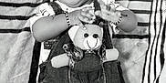 Kiannsha is registered to the contest to win money with this photo: baby, child, denim_overalls, teddy_bear, bracelet, sunglasses_edit, cap_edit, blanket, patterned_blanket, black_and_white, cute, lying_down, infant, clothing, toy, playful, portrait, indoors, human, small_child