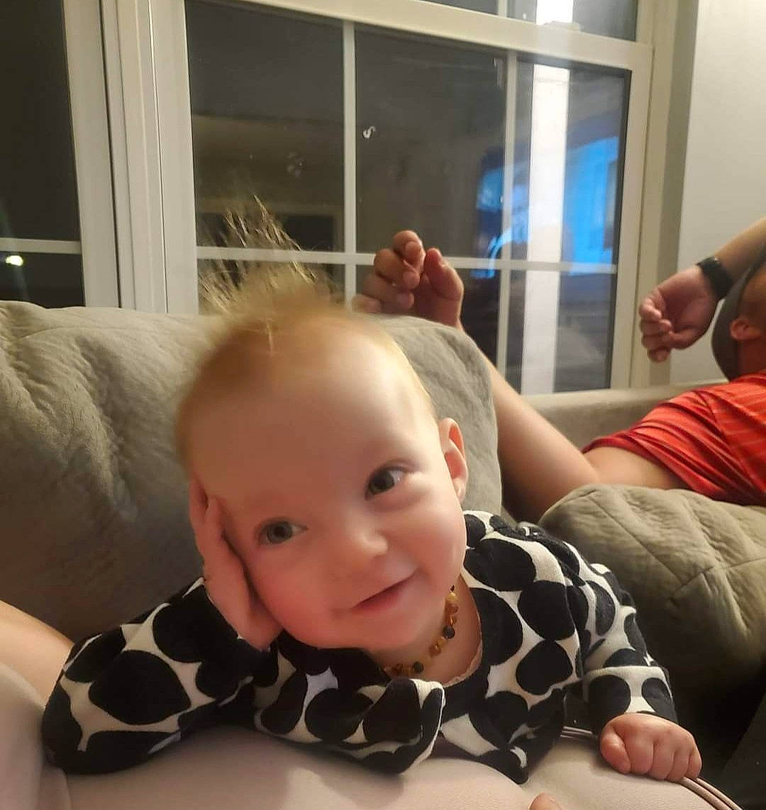 Daisy is registered to the contest to win money with this photo: baby, baby_toddler_clothing, cheek, child, comfort, finger, flooring, fun, gesture, happy, mammal, pattern, person, room, selfie, sitting, sleeve, smile, thumb, toddler