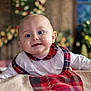 baby, child, smiling, portrait, indoor, plaid, clothing, blanket, face, head, happy, cute, infant, holiday, decor, cozy, warm, background, person, toddler