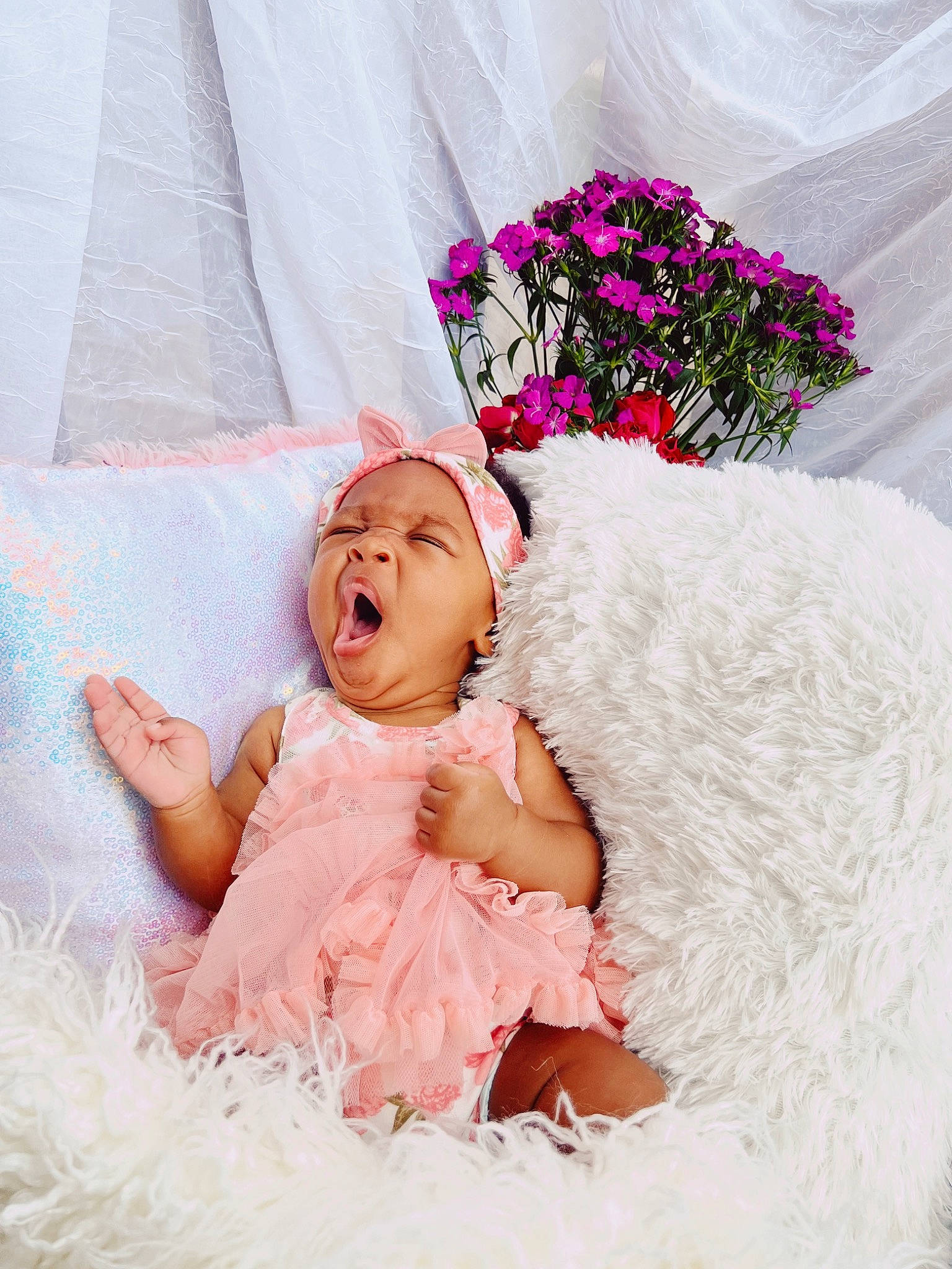 Beau is registered to the contest to win money with this photo: baby, baby_toddler_clothing, bridal_accessory, bridal_clothing, dress, embellishment, event, flower, happy, head, headgear, headpiece, headwear, linens, magenta, person, petal, pink, plant, textile