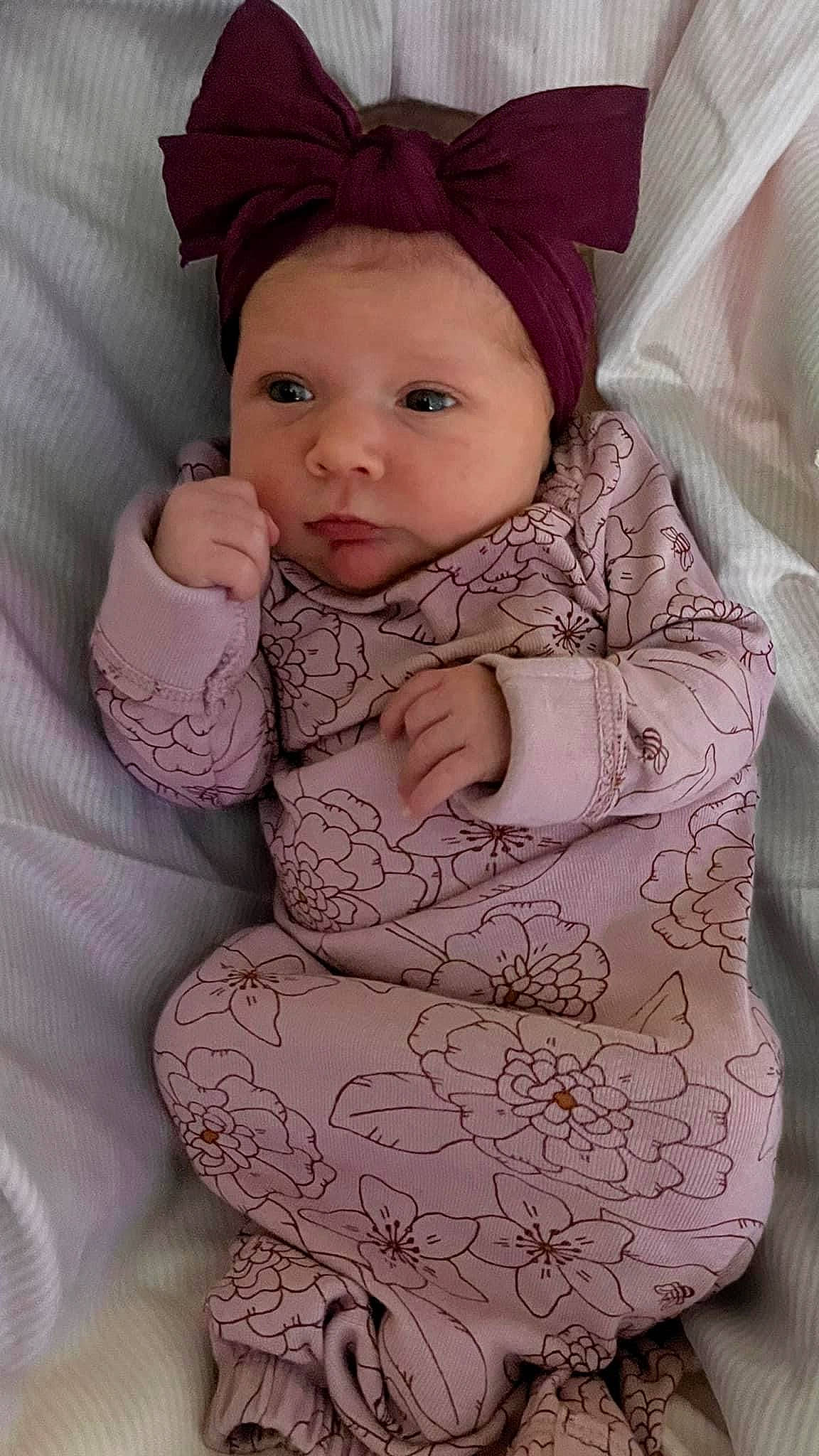 Harlow joined the competition — help win amazing prizes! arm, baby, baby_toddler_clothing, cap, cheek, chin, comfort, dress, eye, face, hand, head, headwear, iris, lip, neck, nose, outerwear, person, pink