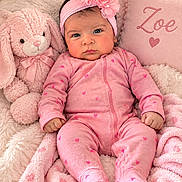 Zoe joined the competition — help win amazing prizes! baby, infant, child, portrait, pink, headband, flower, onesie, hearts, smiling, face, bunny, stuffed_animal, blanket, pillow, nursery, cozy, lying_down, indoor, photography