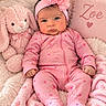 baby, infant, child, portrait, pink, headband, flower, onesie, hearts, smiling, face, bunny, stuffed_animal, blanket, pillow, nursery, cozy, lying_down, indoor, photography