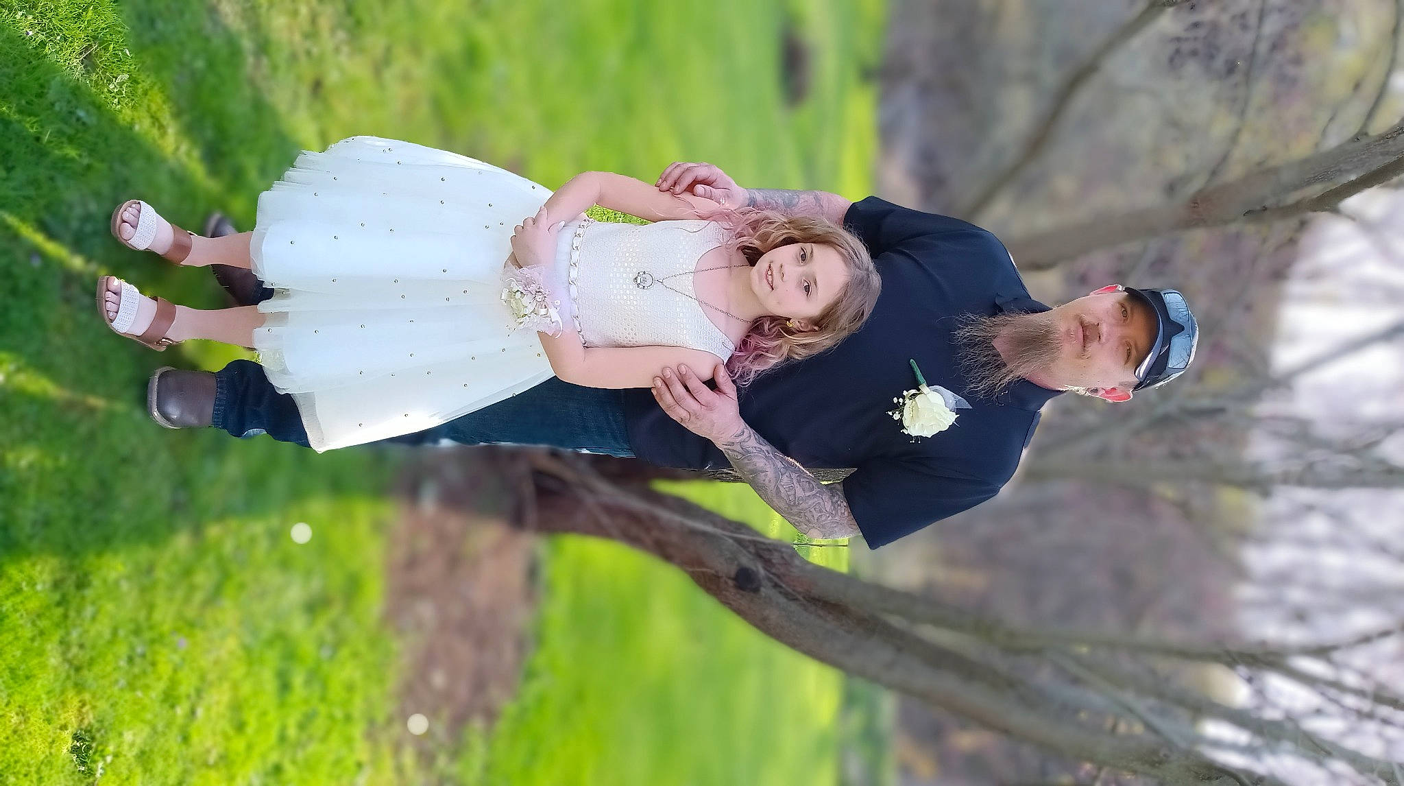 Arianna is registered to the contest to win money with this photo: baby, botany, child, dress, event, facial_expression, fun, grass, hand, happy, headwear, leaf, leg, leisure, people_in_nature, person, plant, recreation, spring, toddler