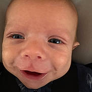 Sawyer joined the competition — help win amazing prizes! baby, face, smile, eyes, close_up, infant, expression, joy, child, skin, head, clothing, blanket, warmth, cute, portrait, young, person, happy, indoors