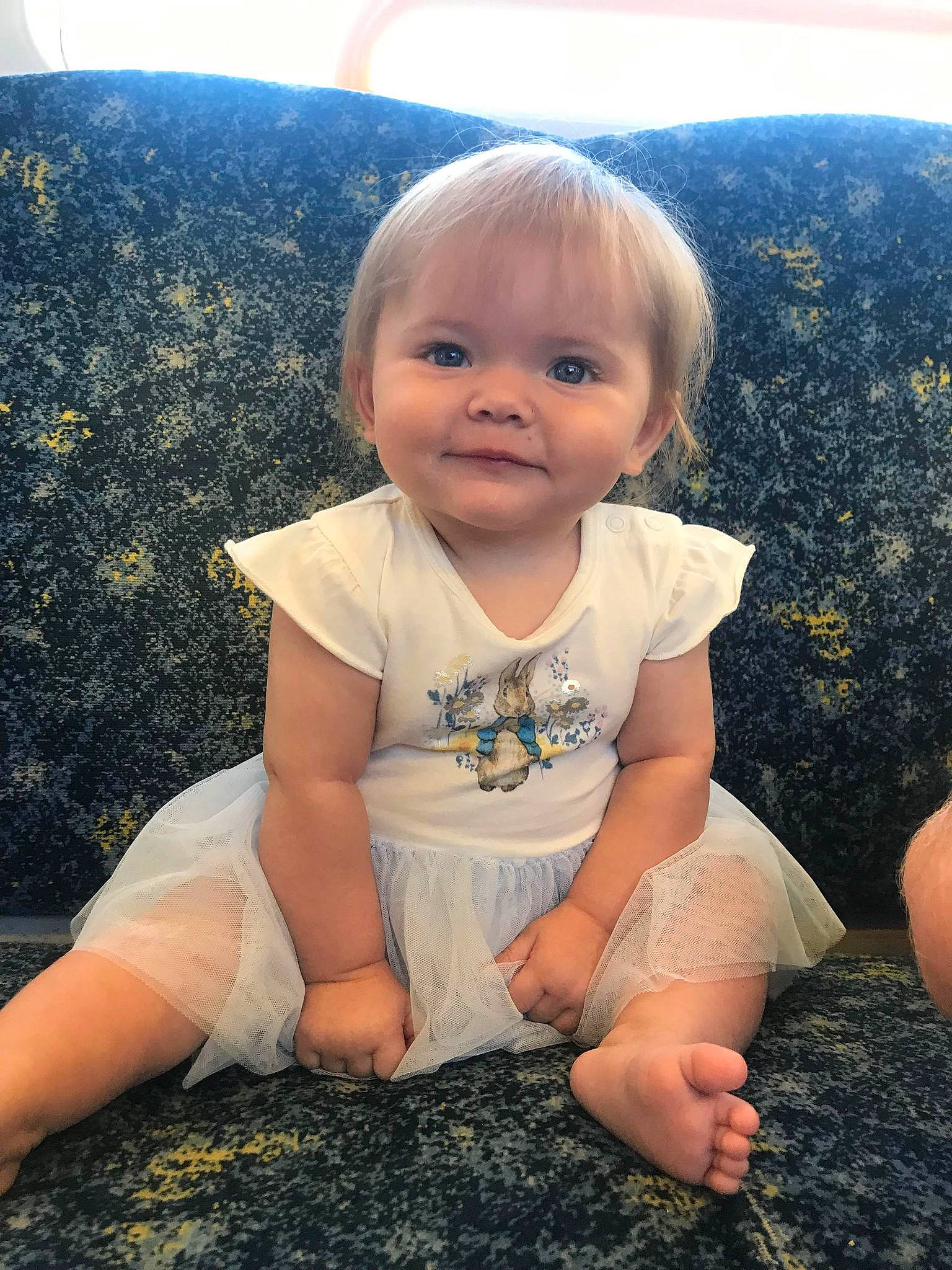 Raya is registered to the contest to win money with this photo: baby, baby_toddler_clothing, cheek, cool, dress, eye, finger, flash_photography, foot, fun, grass, happy, head, human_leg, iris, joy, leg, people_in_nature, person, skin