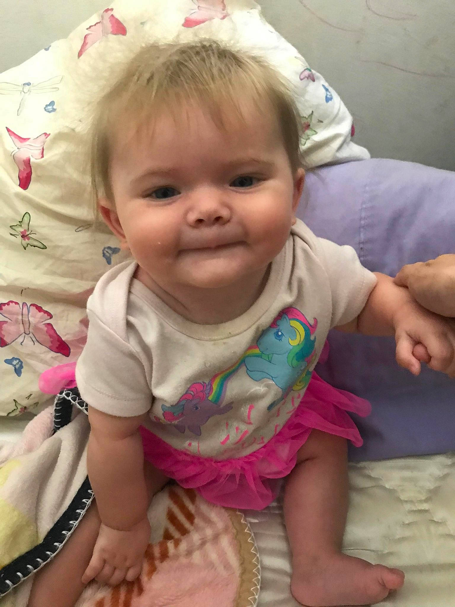 Raya is registered to the contest to win money with this photo: arm, baby_toddler_clothing, cheek, chin, eye, face, facial_expression, hairstyle, head, human, iris, joy, mouth, nose, organ, person, product, skin, sleeve, smile