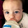 Jensen is registered to the contest to win money with this photo: baby, bib, blanket, blue_eyes, bottle, child, close_up, cozy, face, feeding, front_facing, happy, indoors, infant, pacifier, photography, portrait, sitting, stars, wide_eyed