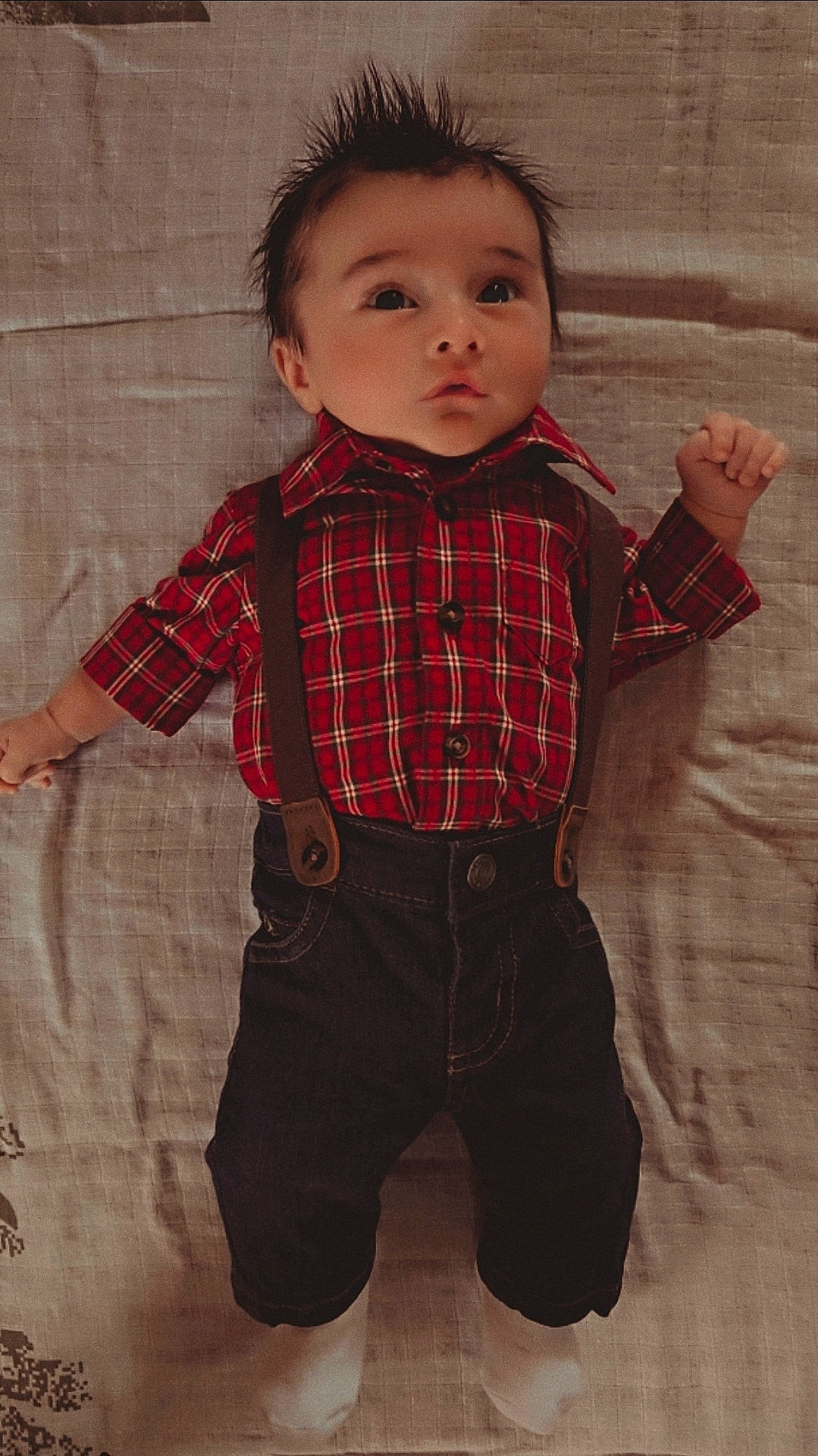Zayne joined the competition — help win amazing prizes! adorable, baby, baby_pose, blanket, casual_clothing, child, curly_hair, cute, fashion, indoors, infant, lying_down, pants, plaid_shirt, portrait, spiky_hair, suspenders, toddler, white_socks, young_child