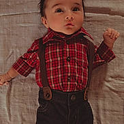 Zayne joined the competition — help win amazing prizes! adorable, baby, blanket, casual, child, clothing, curly_hair, cute, face, fashion, indoor, infant, looking_up, lying_down, person, plaid_shirt, portrait, spiky_hair, suspenders, young