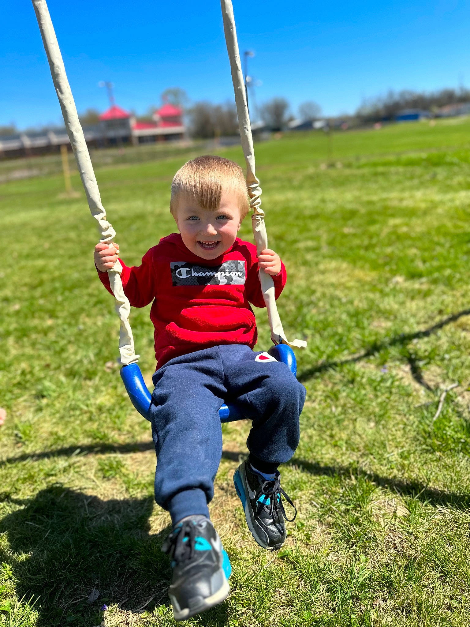 Zaydon joined the competition — help win amazing prizes! child, city, electric_blue, fun, grass, grassland, happy, joy, leisure, meadow, natural_environment, outdoor_play_equipment, people_in_nature, person, plant, playground, recreation, sky, swing, toddler