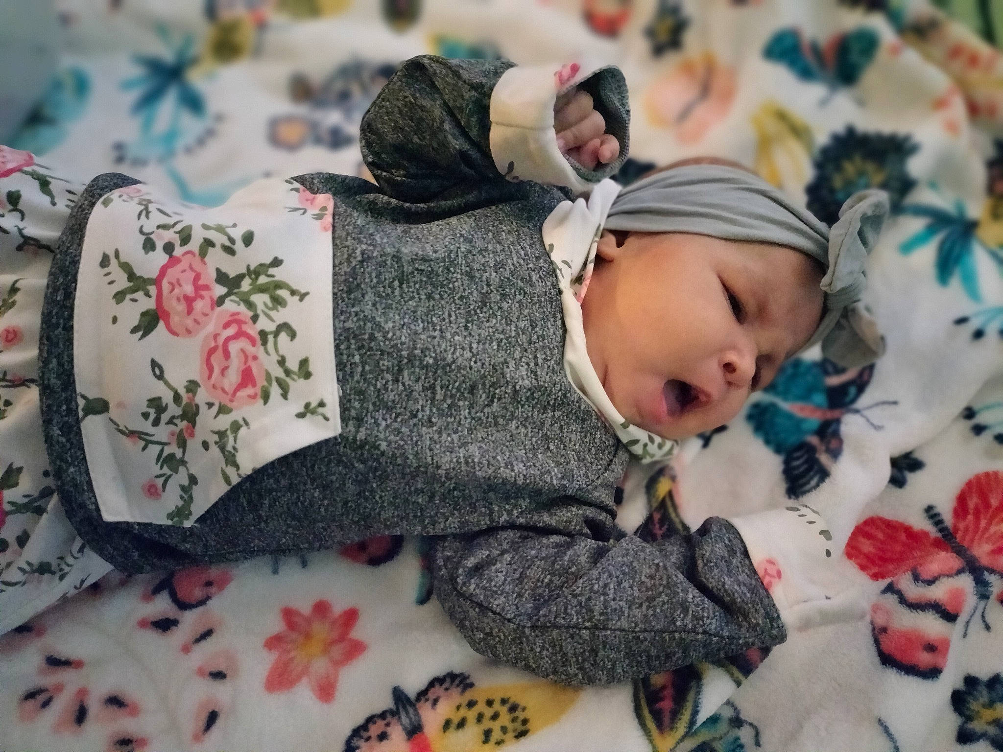 Kinsliegh is registered to the contest to win money with this photo: baby, baby_products, baby_toddler_clothing, beanie, carmine, child, comfort, fashion_accessory, happy, headwear, knit_cap, linens, pattern, person, room, sitting, skin, textile, toddler, tree