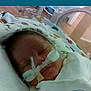 newborn, baby, hospital, incubator, medical_tubes, blanket, sleeping, face, infant, healthcare, care, patient, child, cute, resting, pediatric, nursery, soft, wrapped, peaceful