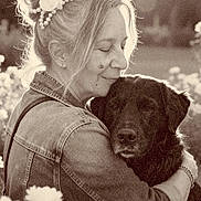 Marley participe au concours pour gagner de l'argent avec cette photo : affection, animal, calm, casual_clothing, closeup, dog, embrace, flower, friendship, grass, happy, headpiece, love, nature, outdoor, pet, portrait, sepia, sunlight, woman