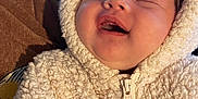 Jasmine joined the competition — help win amazing prizes! baby, infant, newborn, smiling, closed_eyes, hood, fuzzy_jacket, zipper, cozy, cute, chubby_cheeks, portrait, closeup, indoor, blanket, brown_sleeve, soft_texture, sleeping, happy, person