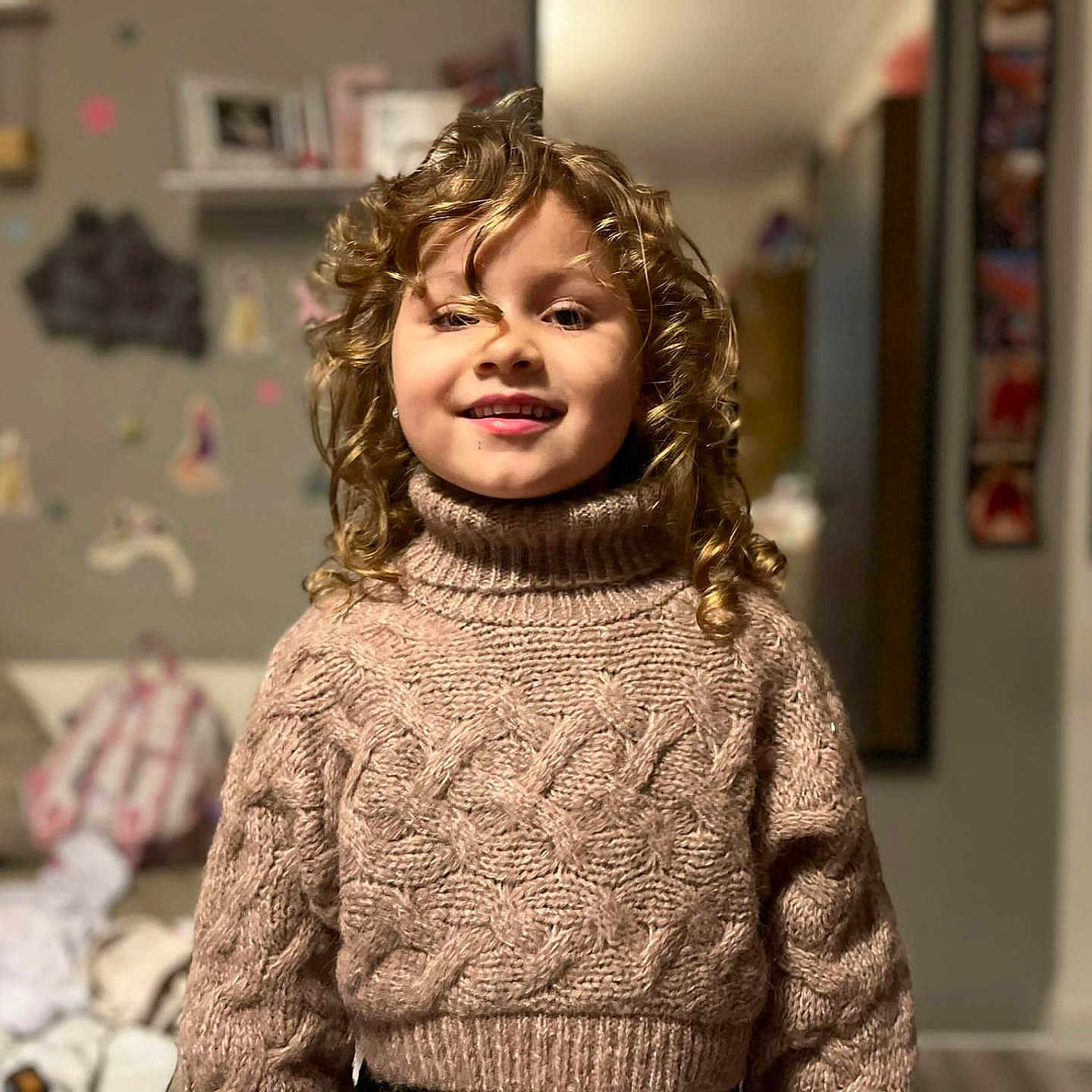 Beatris Adriana is registered to the contest to win money with this photo: baby, blackhair, blonde, brownhair, clothing, curlyhair, face, hair, happy, head, knitwear, person, smile, sweater