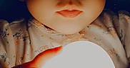 Elora joined the competition — help win amazing prizes! baby, child, closeup, clothing, curious, cute, dark_background, expression, face, glowing_orb, hands, indoor, infant, lighting, mystical, night, portrait, skin, small_hands, soft_light