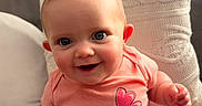 Willow joined the competition — help win amazing prizes! baby, infant, smiling, cute, pink_clothing, onesie, butterfly, happy, cheeks, sitting, couch, pillow, cozy, indoors, child, portrait, skin, face, hands, eyes