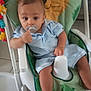 baby, baby_chair, blue_outfit, child, cute, face, floor, furniture, hand, indoor, infant, leg, lion_design, pacifier, person, seat, smile, thumbs_up, toddler, toy