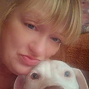 Diamond is registered to the contest to win money with this photo: animal, blonde_hair, canine, close_up, companion, cute, dog, eyes, face, friendship, indoor, looking_at_camera, nose, person, pet, portrait, selfie, snuggling, warm_lighting, woman