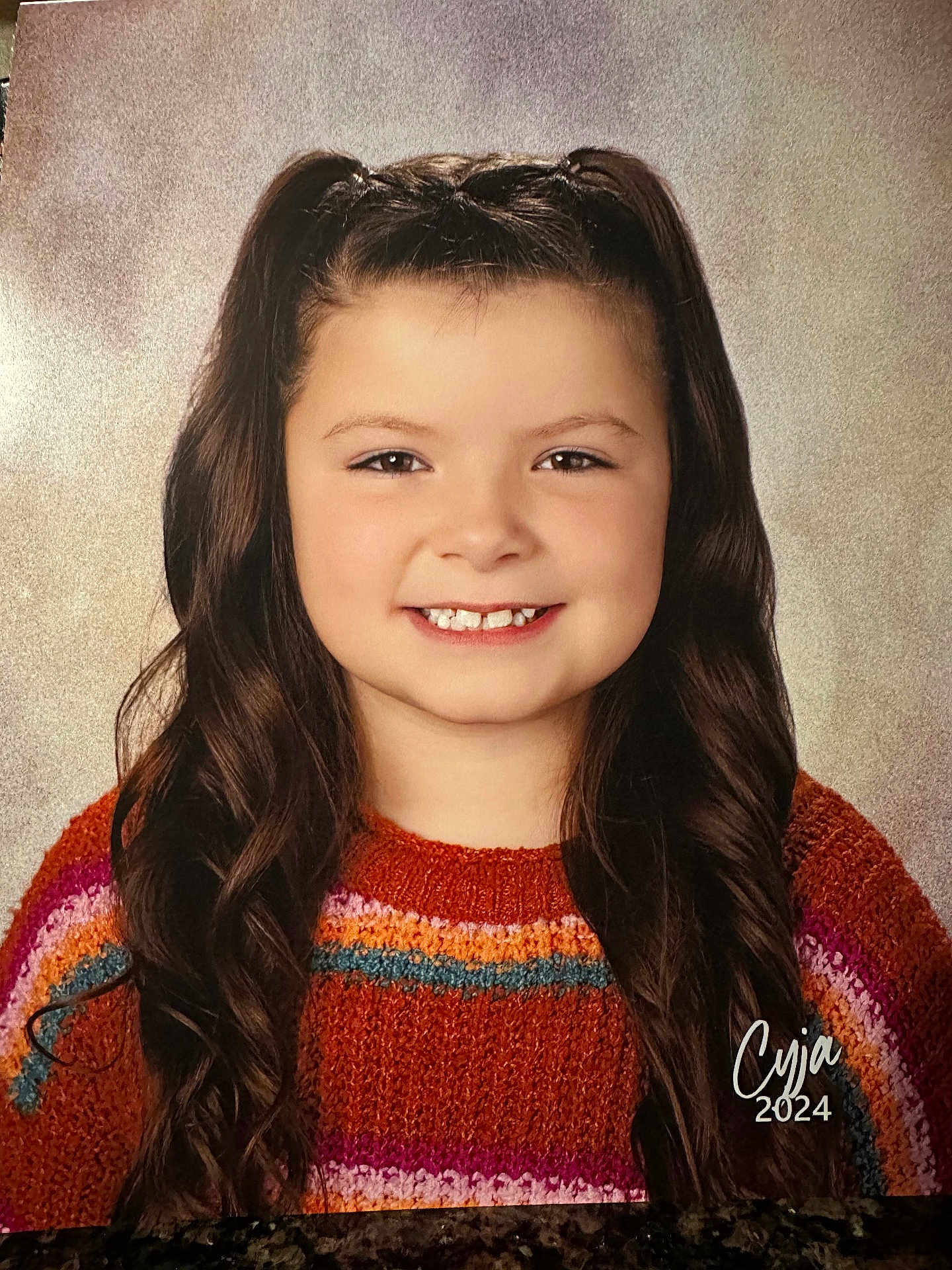 Cyja is registered to the contest to win money with this photo: blackhair, bodypart, brownhair, child, clothing, dimples, face, female, girl, hair, happy, head, knitwear, mouth, neck, person, photography, portrait, smile, sweater