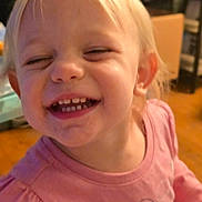 Renleigh is registered to the contest to win money with this photo: child, toddler, smile, teeth, pink_shirt, indoor, face, happy, blond_hair, person, closeup, joyful, cute, young_child, expression, portrait, head, cheerful, clothing, skin