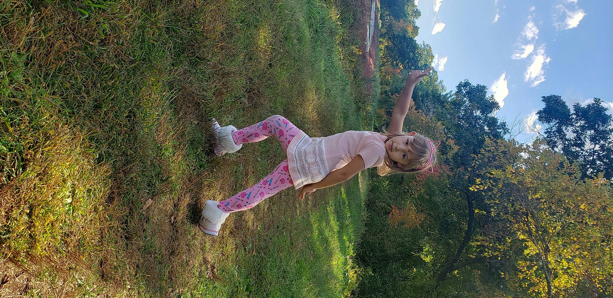Denise is registered to the contest to win money with this photo: cloud, fun, grass, grass_family, grassland, happy, landscape, leisure, magenta, people_in_nature, person, plant, recreation, reflection, shadow, shrub, sky, toddler, tree, water