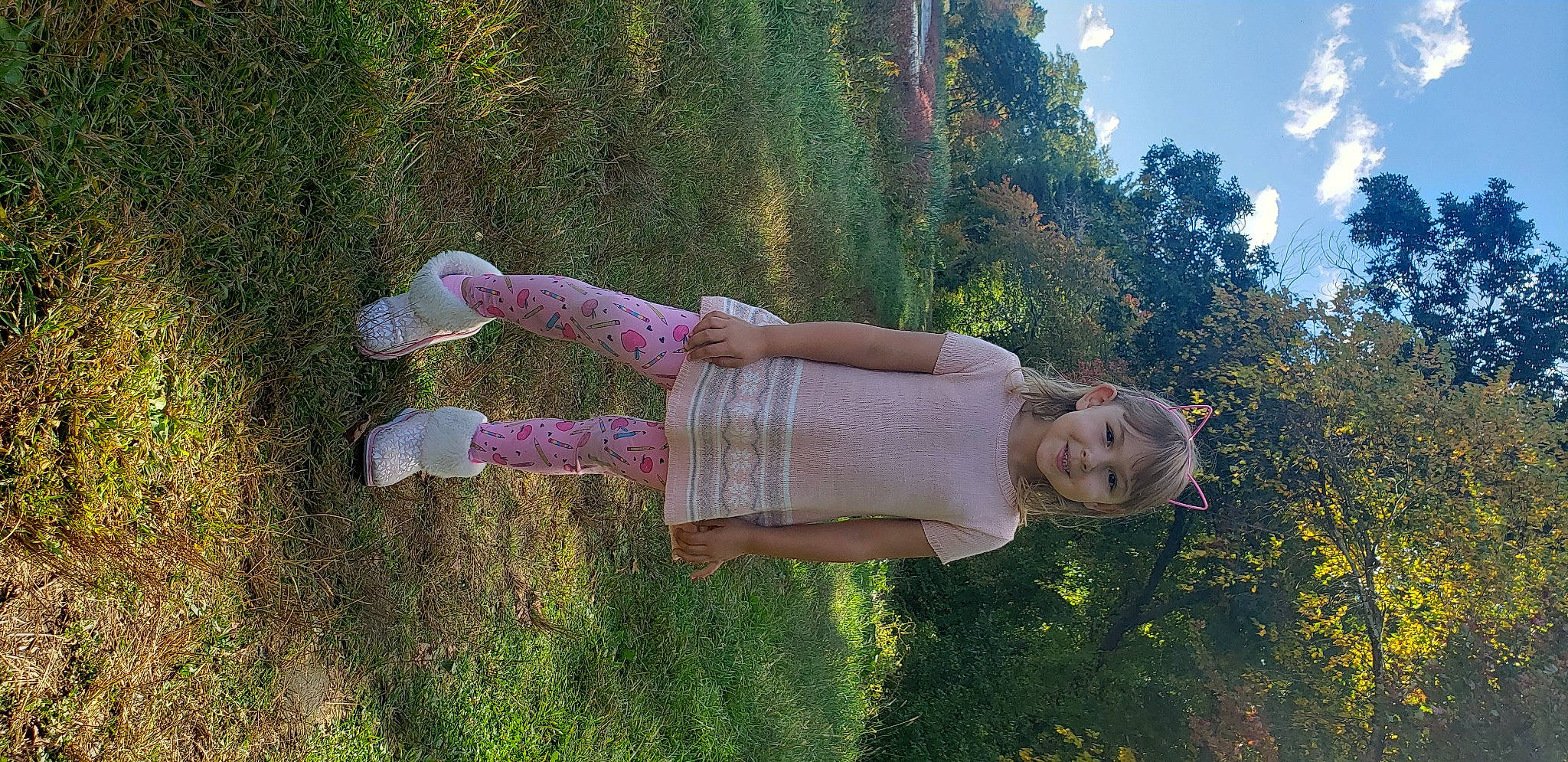 Denise is registered to the contest to win money with this photo: botany, child, cloud, fun, garden, grass, grassland, happy, human_leg, joy, landscape, leaf, leisure, lens_flare, people_in_nature, person, plant, shrub, sky, smile