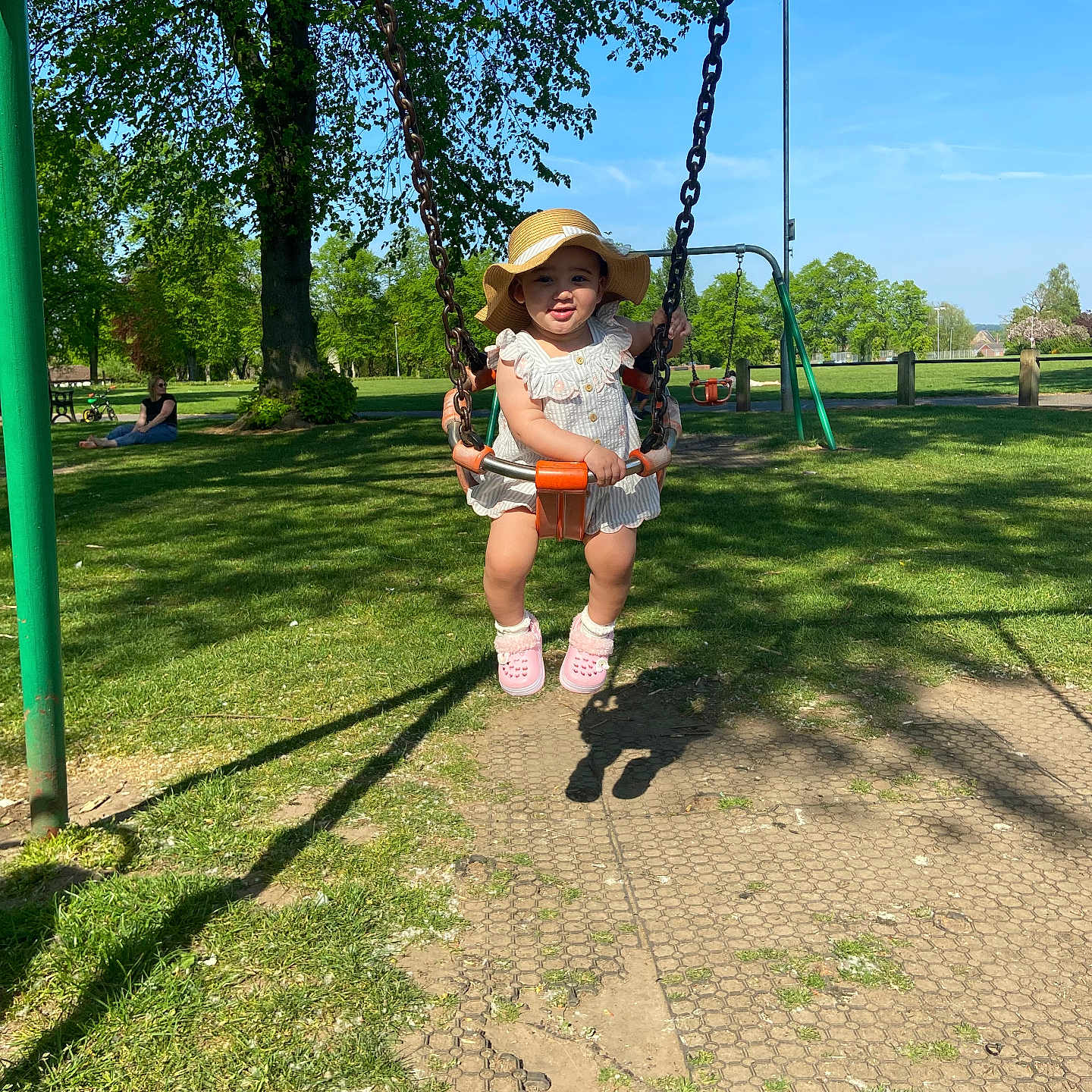 Alora-Mae is registered to the contest to win money with this photo: blue_sky, child, daylight, fun, grass, leisure, nature, outdoor, park, person, playground, recreation, shadow, shoes, smiling, summer, sunhat, swing, toddler, tree