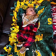 Tucker joined the competition — help win amazing prizes! baby, blanket, child, clothing, comfortable, couch, cozy, cute, fleece, home, indoors, infant, leather, moose, peaceful, portrait, red_black_checkered, resting, sleeping, slippers