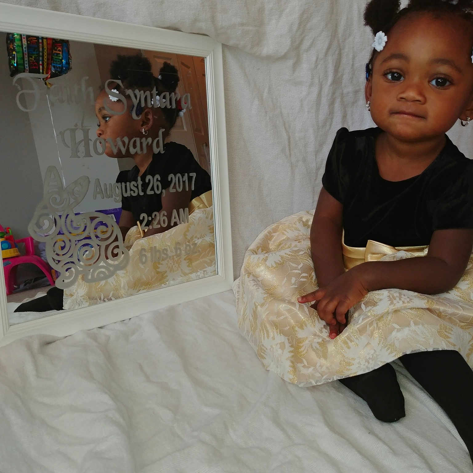 Faith is registered to the contest to win money with this photo: child, costume, dress, furniture, hair, hairstyle, linens, person, skin, smile, textile, toddler