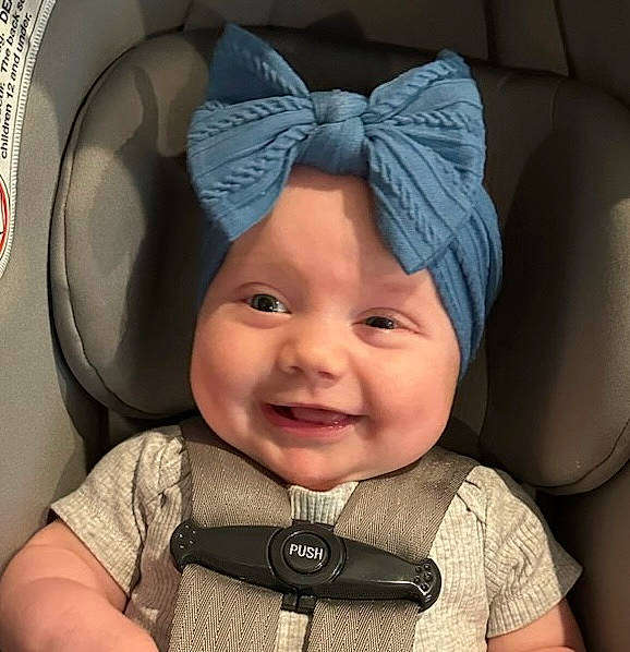 Haven is registered to the contest to win money with this photo: baby, cap, car_seat, child, comfort, electric_blue, eye, face, fashion_accessory, gesture, happy, hat, head, headwear, joy, mouth, outerwear, person, photograph, selfie