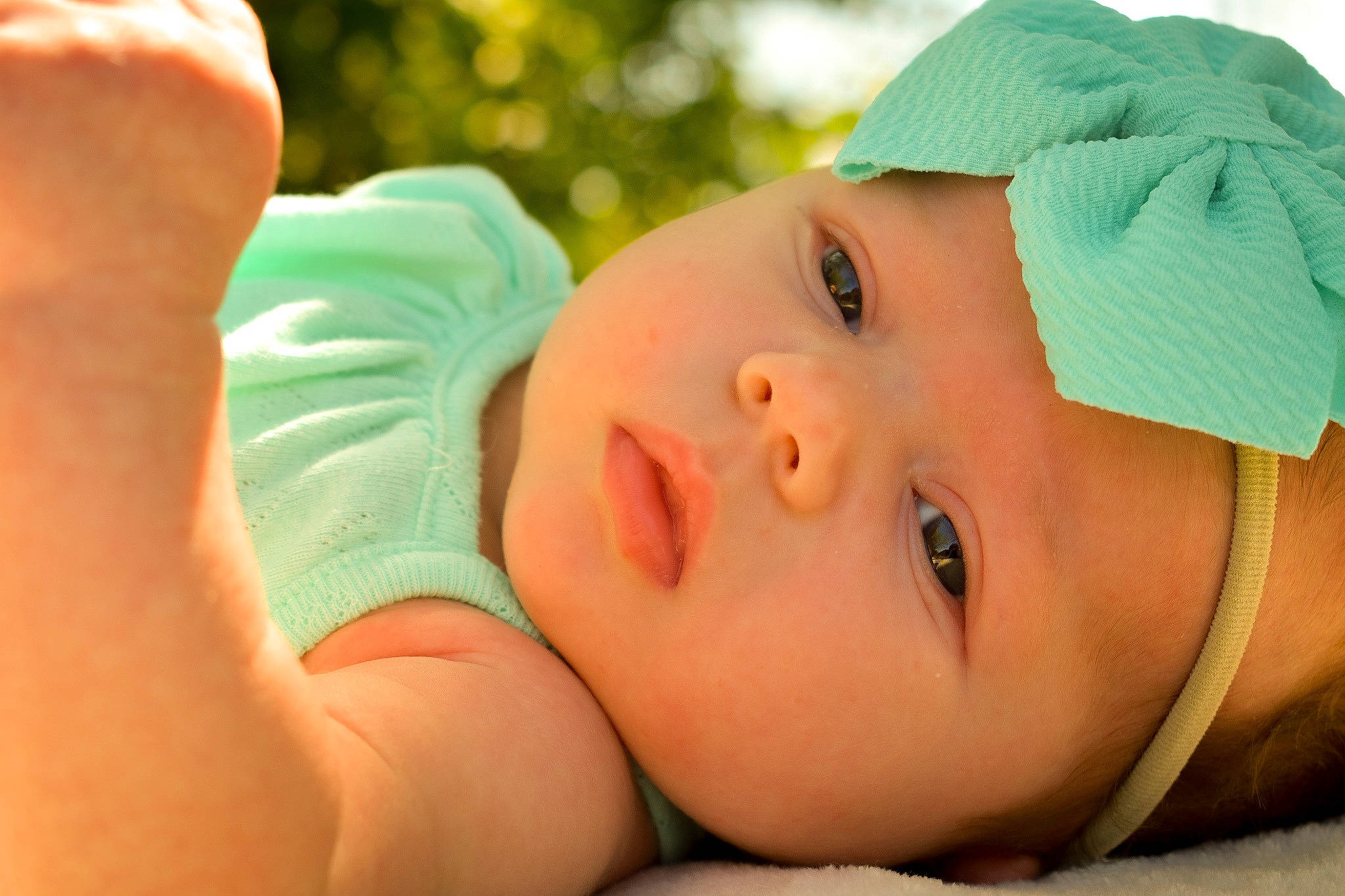 Wrenley is registered to the contest to win money with this photo: baby, cheek, child, close_up, face, head, headgear, headwear, lip, mouth, nose, person, skin, smile, toddler