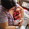 Lilliana joined the competition — help win amazing prizes! newborn, baby, mother, woman, holding, hospital, wristband, window, natural_light, indoor, caring, love, skin_to_skin, diaper, pillow, purple_clothing, resting, infant, family, bond