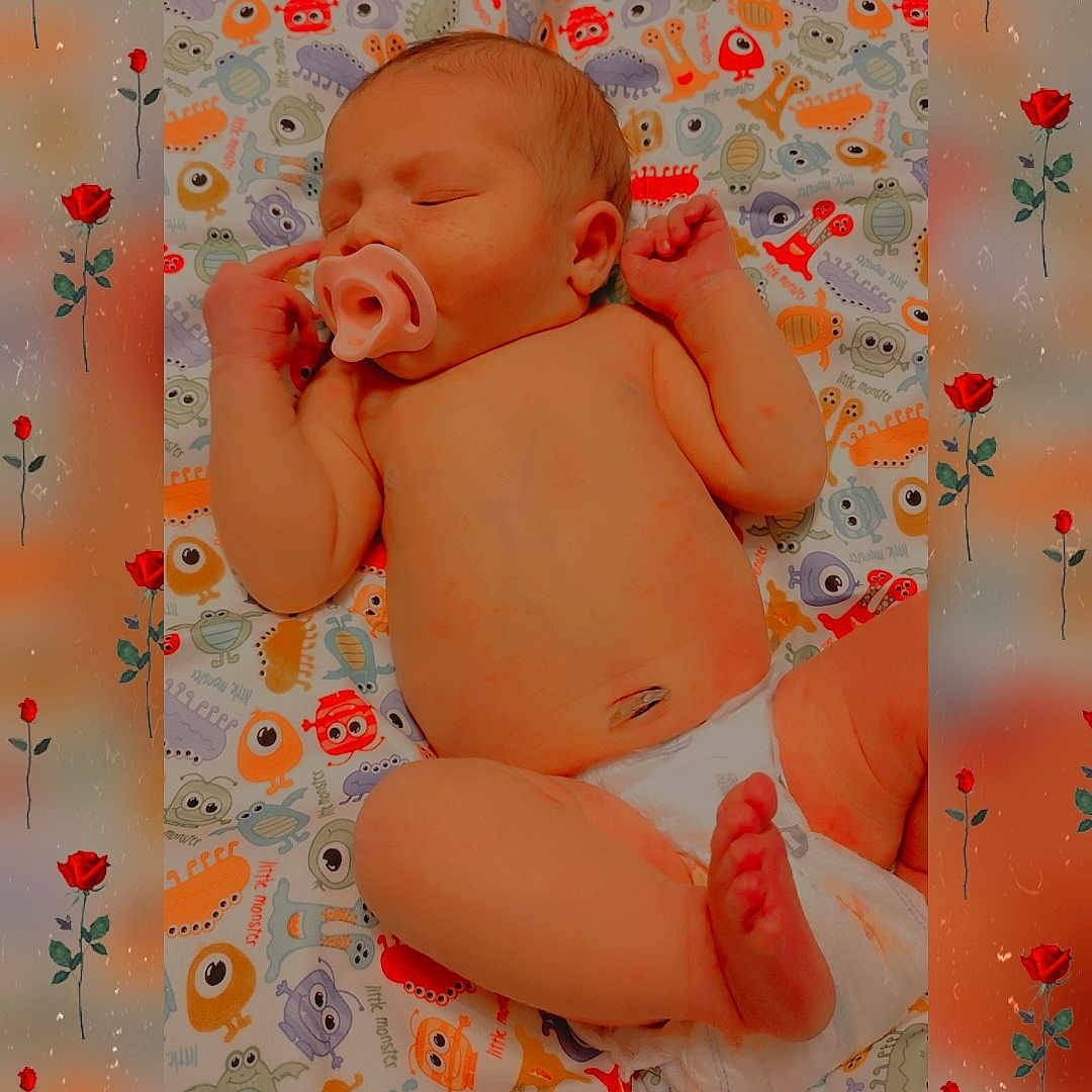 Lilliana joined the competition — help win amazing prizes! baby, newborn, sleeping, pacifier, diaper, blanket, colorful, monster_pattern, infant, cute, peaceful, child, skin, face, hand, foot, lying_down, roses, floral_overlay, portrait