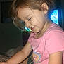 Aerith is registered to the contest to win money with this photo: child, girl, braided_hair, pink_shirt, green_shorts, bowl, noodles, spoon, eating, indoor, smiling, happy, sitting, blanket, room, television, food, casual_clothing, young, portrait