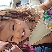 Aerith is registered to the contest to win money with this photo: child, adult, smile, glasses, hair, indoor, window, light, happy, person, portrait, casual, tshirt, face, closeup, family, toddler, woman, fun, together