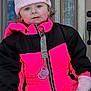 Mariana is registered to the contest to win money with this photo: child, toddler, winter_clothing, pink_hat, mittens, snowsuit, pacifier, outdoor, door, curious_expression, face, blue_eyes, cold_weather, front_porch, zipper, knit_hat, winter, young_child, clothing, person
