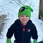 Zachariah is registered to the contest to win money with this photo: toddler, child, smiling, winter_clothing, hat, mittens, snow, outdoor, jacket, jeans, pathway, blue_eyes, happy, cold_weather, playful, beanie, casual, cute, person, daylight