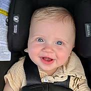 Ledger joined the competition — help win amazing prizes! baby, child, car_seat, smiling, blue_eyes, infant, happiness, safety_harness, cute, portrait, close_up, seatbelt, young_child, happy, person, skin, clothing, indoor, face, infancy