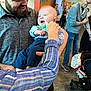 Ledger joined the competition — help win amazing prizes! baby, man, adult, smiling, bowtie, shirt, jeans, stroller, indoor, carpet, people, hand, laughing, casual_clothing, glasses, beard, family, gathering, colorful_wall, happy